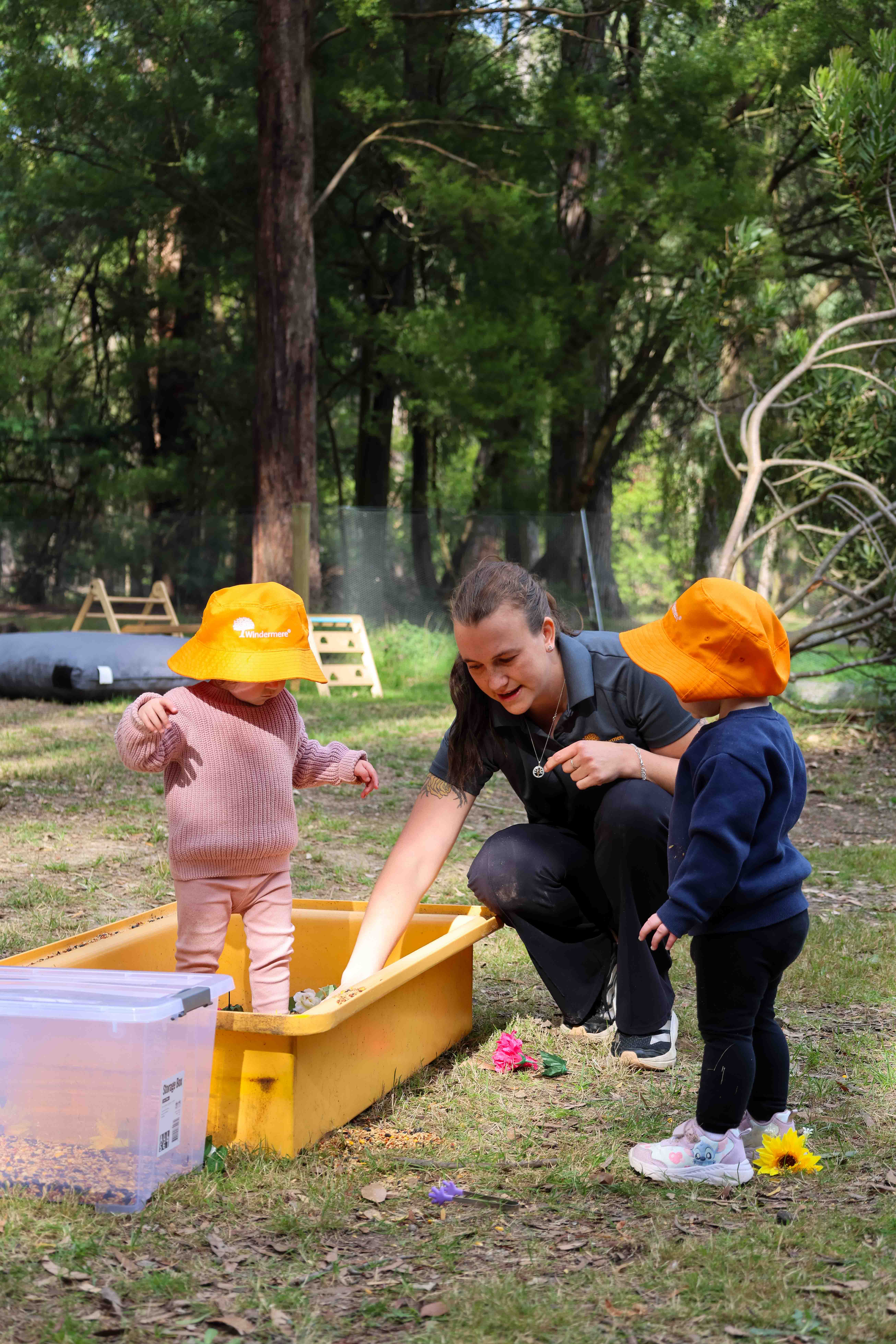 Family Day Care Educator Rhianna playing with children outdoors